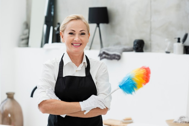 Smiley woman cleaning Free Photo