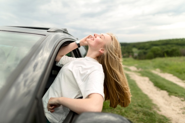 Free Photo | Smiley woman enjoying a car ride