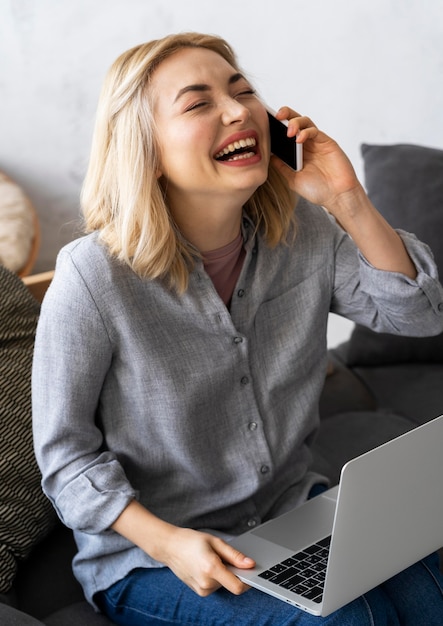 Premium Photo Smiley Woman Laughing While Talking On The Phone