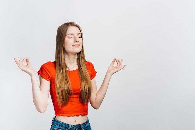 Free Photo | Smiley woman meditating with copy space