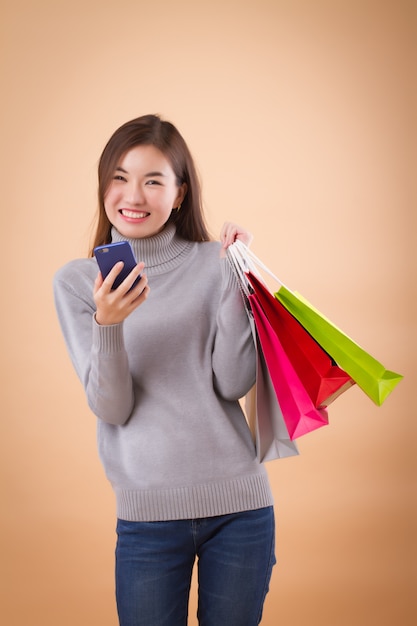 Premium Photo Smiling Asian Woman With Shopping Bags And Mobile Phone   Smiling Asian Woman With Shopping Bags Mobile Phone 46728 272 