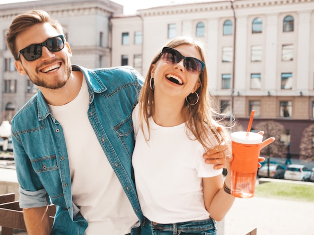 Smiling beautiful girl and her handsome boyfriend in casual summer clothes. Free Photo