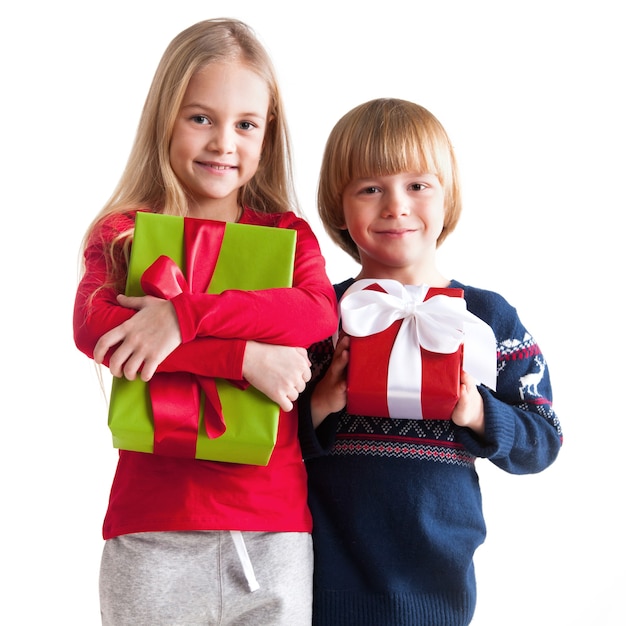 Premium Photo | Smiling boy and girl with gifts isolated on white