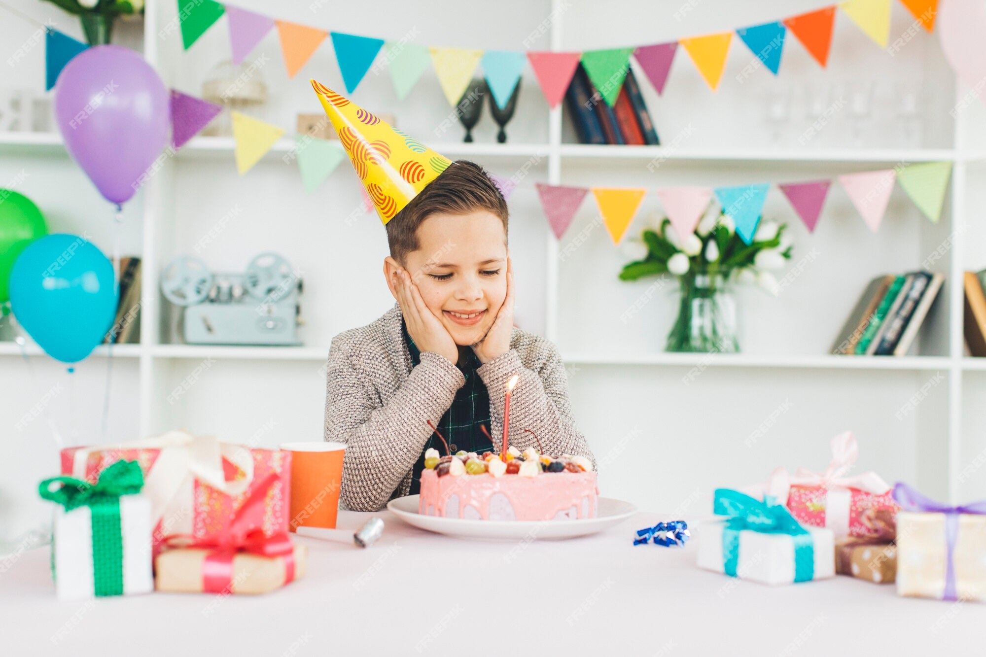 Free Photo | Smiling boy with a birthday cake