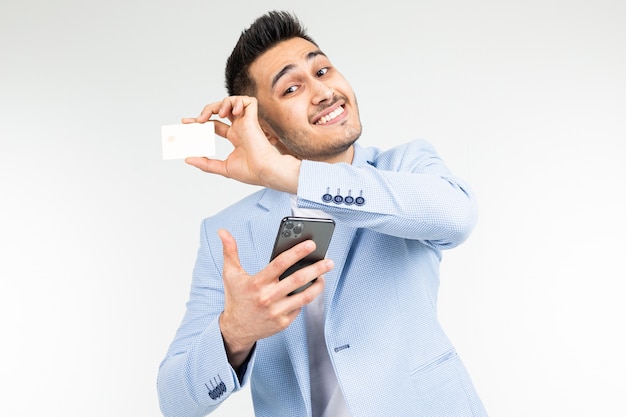 Download Premium Photo | Smiling businessman in a blue jacket with ...