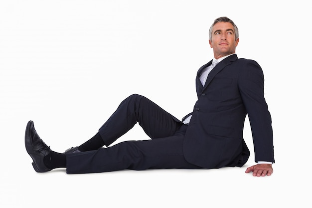 Stockfoto Mature Man Sitting On The Floor