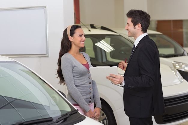 Premium Photo | Smiling businessman speaking with his customer