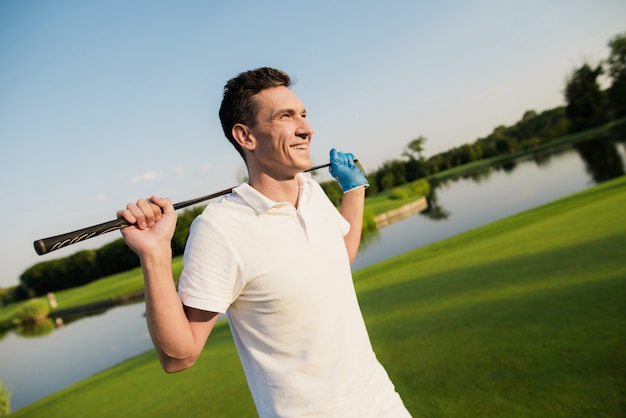 Premium Photo | Smiling golf player in white has luxury sports.