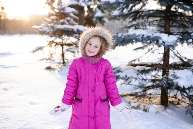 Premium Photo | Smiling kid girl 5-6 year old wear pink winter jacket ...