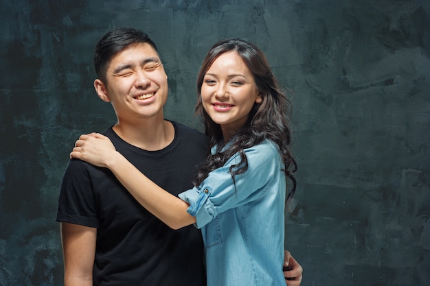 Smiling Korean Couple On Gray Photo Free Download