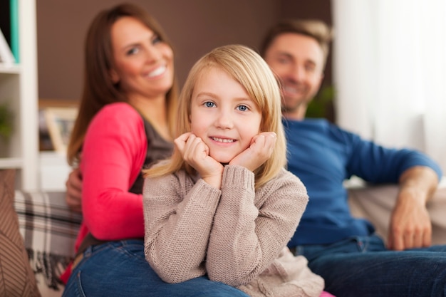 Free Photo | Smiling little girl with parents at home