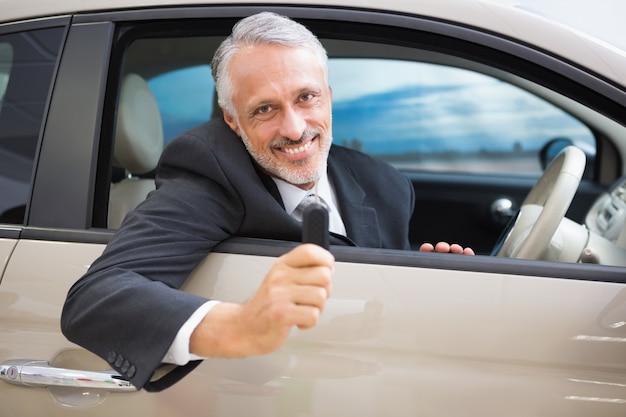 Premium Photo | Smiling man holding car keys