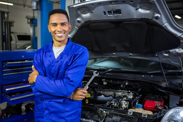 online how mechanic to be a mechanic crossed Photo with Smiling arms and spanner