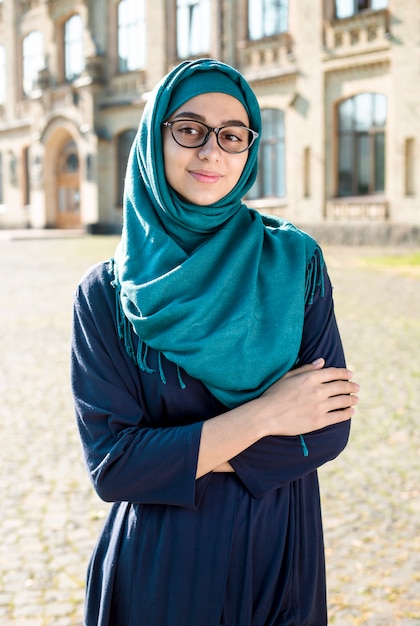 Premium Photo Smiling Muslim Young Business Woman In Hijab Happy Arab Girl Student With Glasses Beautiful Islamic Female