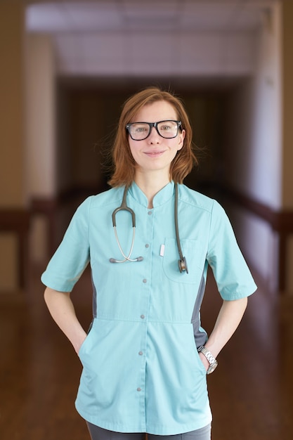 Premium Photo Smiling Portrait Of White Redhead Woman Doctor With