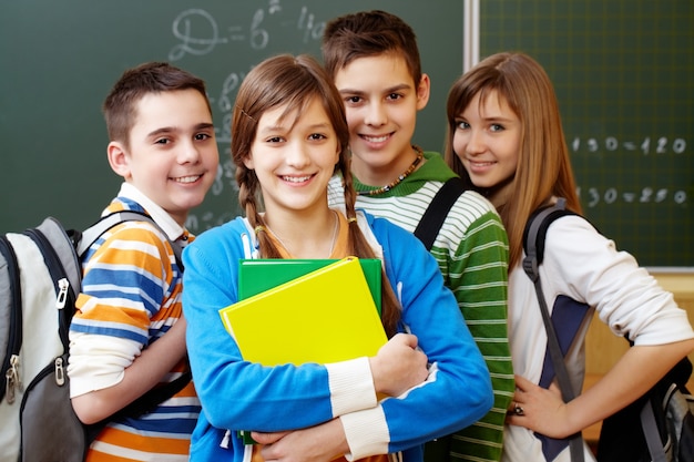 Smiling students with backpacks Free Photo