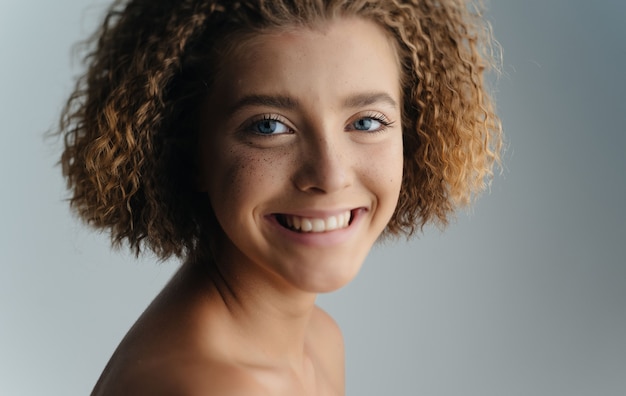 Premium Photo Smiling Woman Curly Hairstyle Bared Shoulders Close Up High Quality Photo