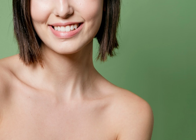 Free Photo | Smiling woman posing with bare shoulders