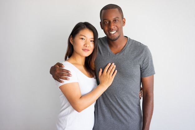 Free Photo Smiling Young African Man Hugging His Asian Girlfriend 