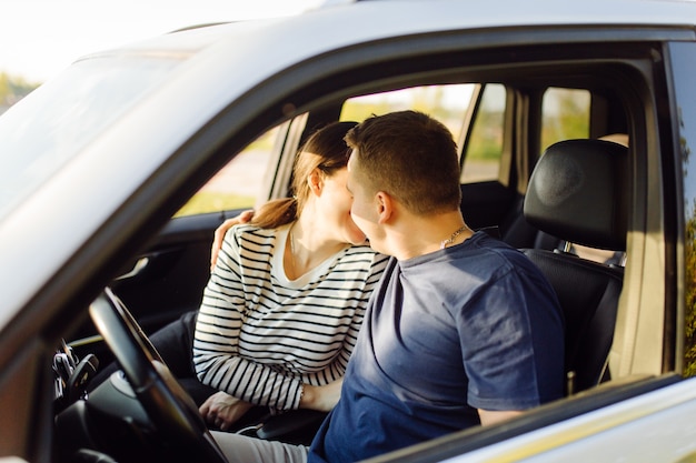 Premium Photo Smiling Young Couple Inside A Car Kissing In The Car