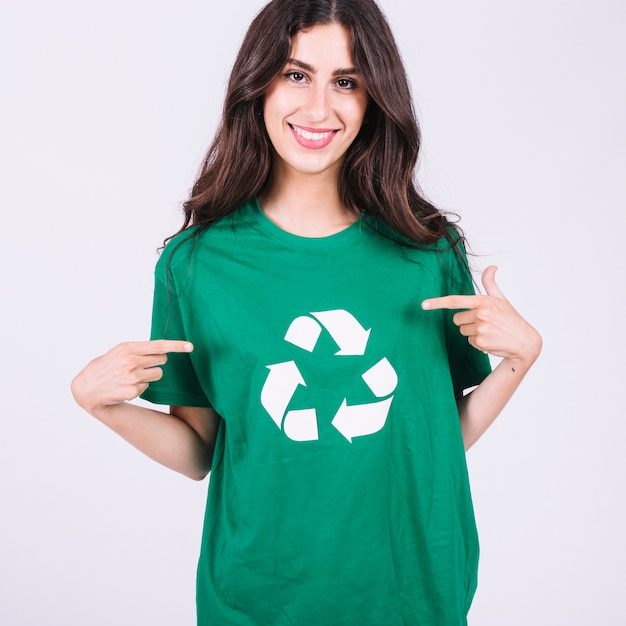 Download Free Free Photo Smiling Young Woman In Green T Shirt Showing Recycle Icon Use our free logo maker to create a logo and build your brand. Put your logo on business cards, promotional products, or your website for brand visibility.