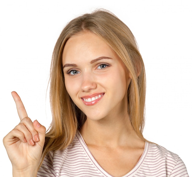 Premium Photo | Smiling young woman pointing