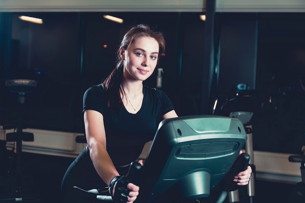 riding the bike at the gym