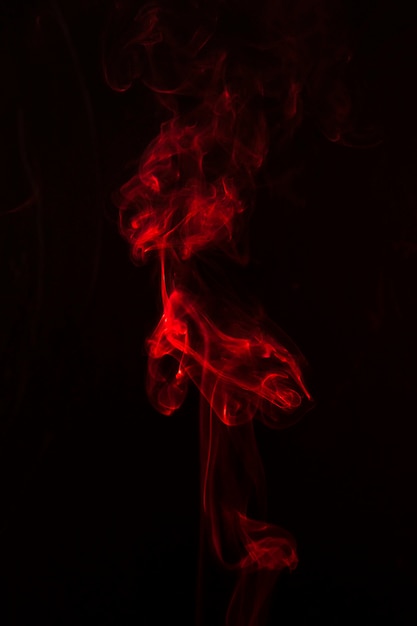 Smoke bright red effect on the black background Photo | Free Download