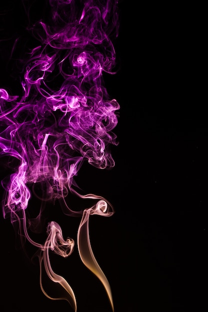 Premium Photo | Smoke on pink neon color in black background