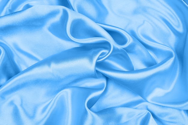 Premium Photo | Smooth elegant blue silk or satin texture can use as