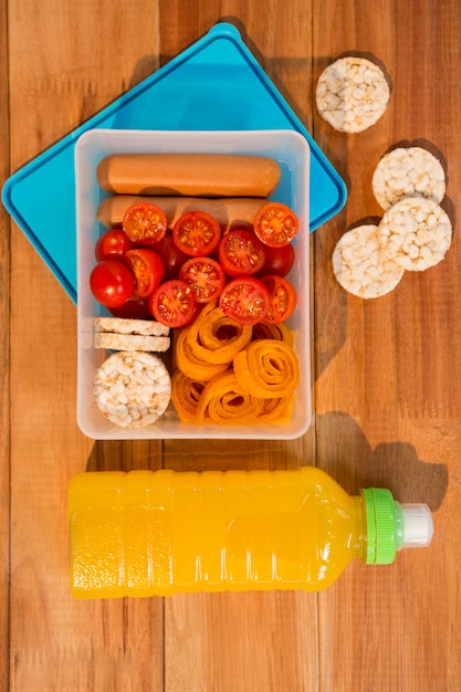 Free Photo | Snacks and juice on wooden table