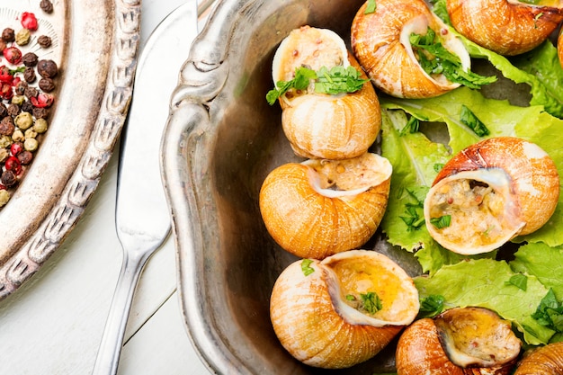 Premium Photo | Snail or escargots with garlic butter.french and ...