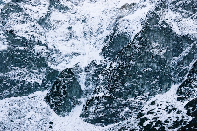 Premium Photo Snow Capped Mountain Close Up The Texture Of The Stones In The Snow