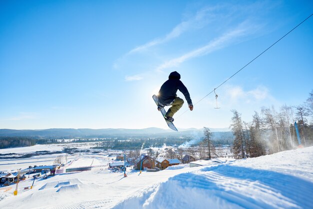 Premium Photo | Snowboarder doing stunts