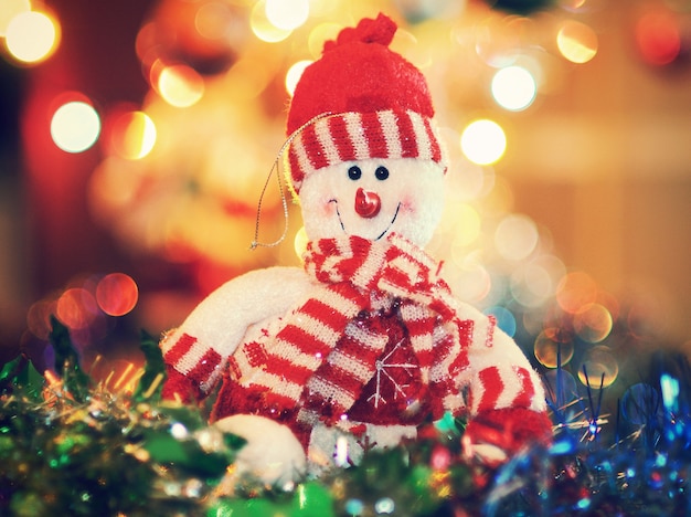 Premium Photo Snowman In A Striped Scarf