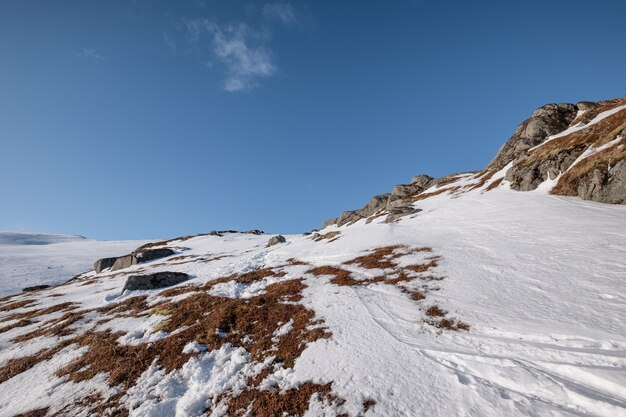 Premium Photo Snowy Mountain With Rocks And Blue Sky In Alpine On Winter