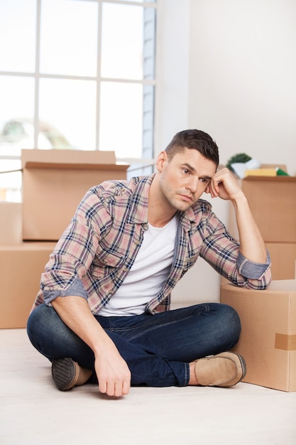 Premium Photo | So much work ahead. depressed young man sitting on the ...