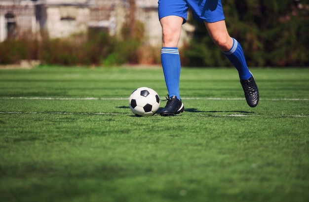 Premium Photo | Soccer ball on green playground. soccer concept