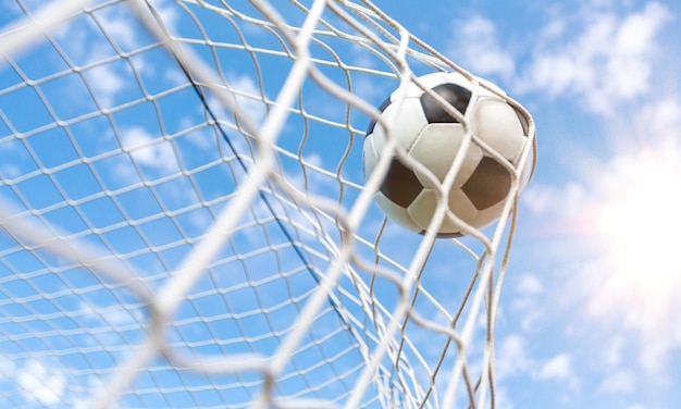 Premium Photo | Soccer ball in a net sport and activity concept