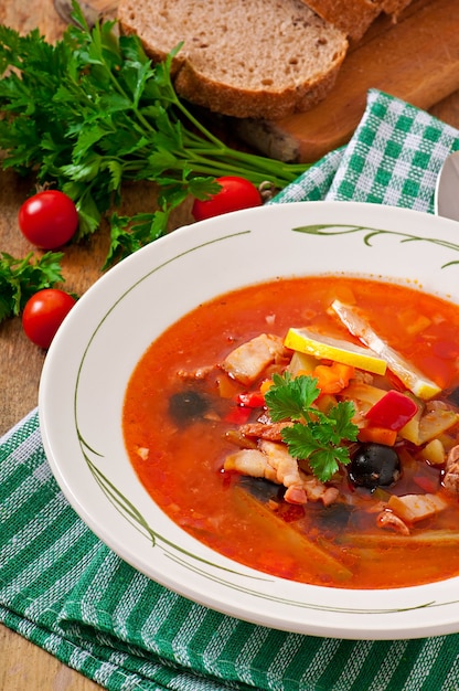 Free Photo | Soup solyanka russian with meat, olives and gherkins in ...