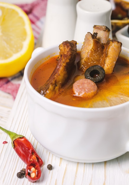 Premium Photo Soup With Smoked Meat Olives And Lemon Solyanka Soup