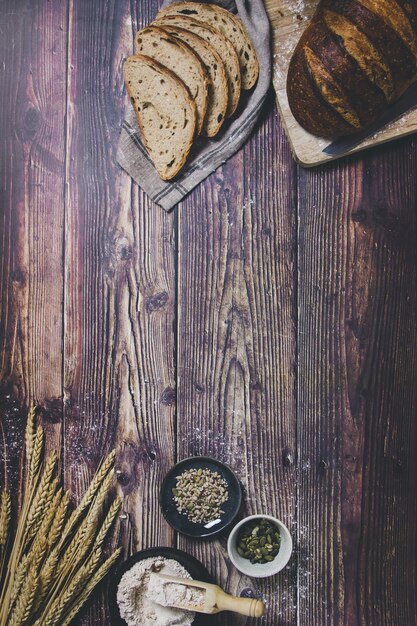 premium-photo-a-sourdough-bread-and-the-ingredients-used-for-making