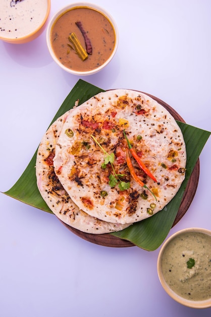 Premium Photo | South indian food uttapam or ooththappam or uthappa is ...