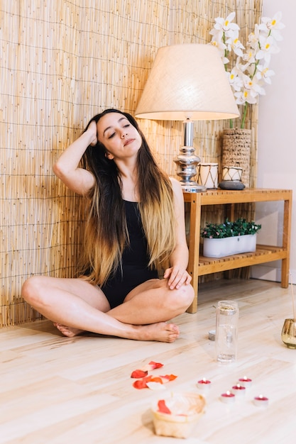 Free Photo | Spa concept with relaxed woman sitting on floor