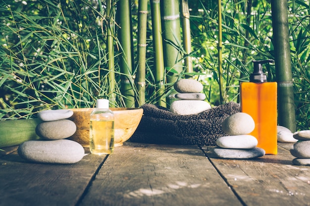 Premium Photo | Spa with woman hands and clear water on an old wood