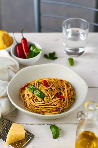 Premium Photo | Spaghetti pasta aglio e olio with chili flakes parsley ...