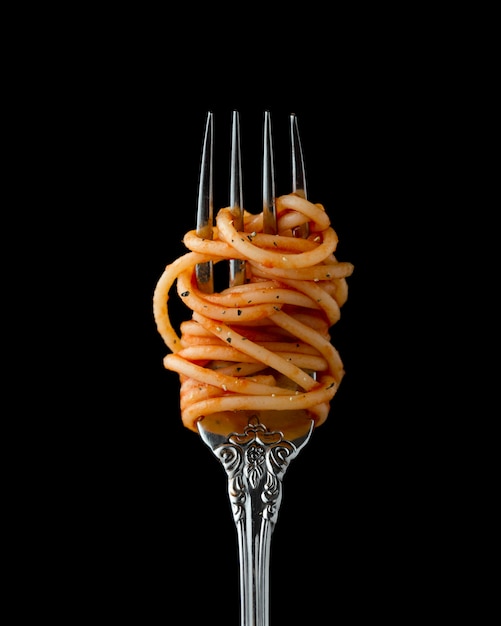 Spaghetti rolled on a fork, closeup Photo Free Download