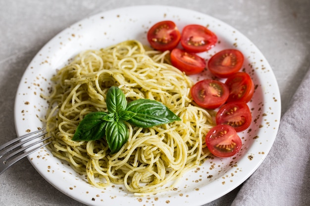 Premium Photo | Spaghetti With Homemade Pesto Sauce, Basil Leaves And ...