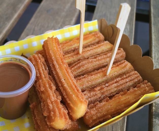 premium-photo-spanish-cinnamon-churros-with-chocolate-dipping-sauce