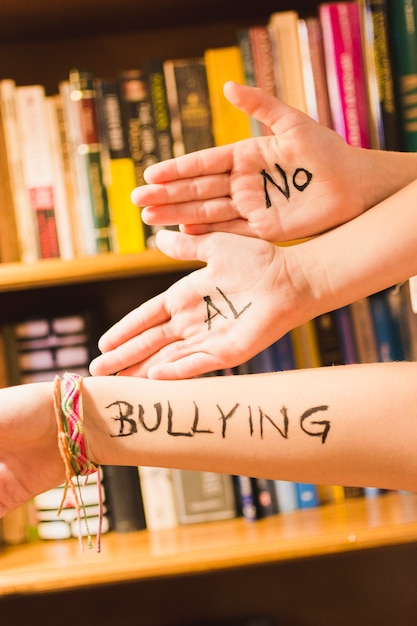 spanish-message-against-bullying-on-children-s-hands-free-photo